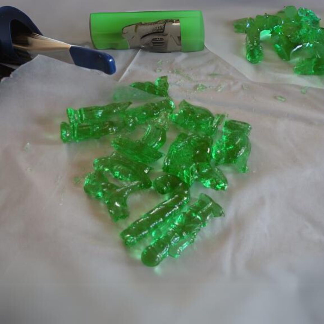 Green Clear Toy Candy on a White Tablecloth