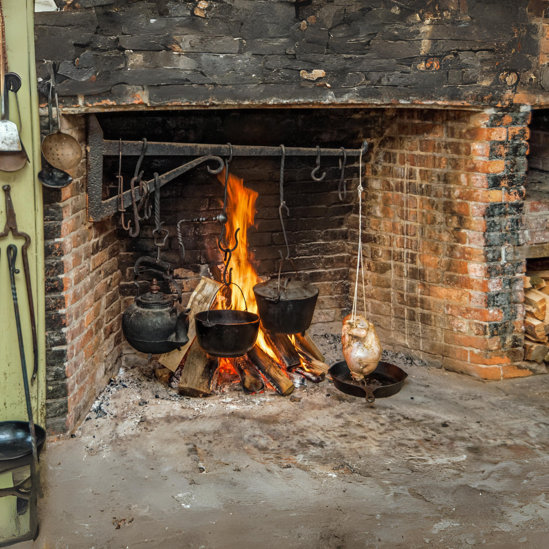Open Hearth Cooking on a Fire in a Brick Fireplace