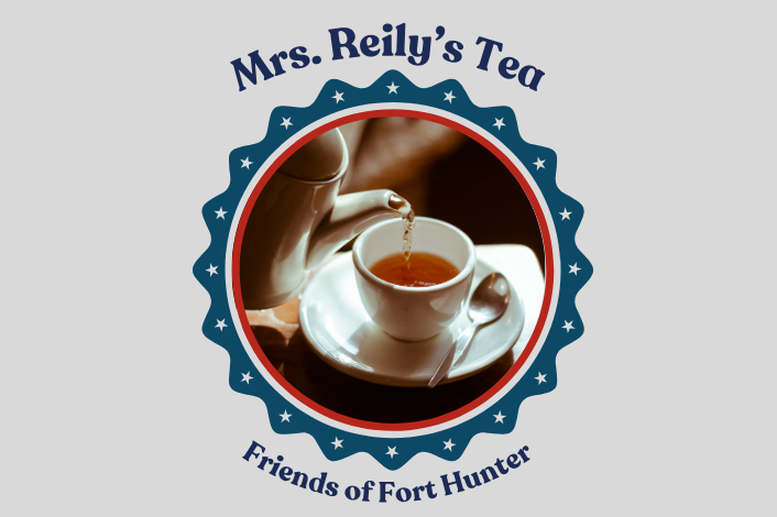 Tea being poured into a cup with saucer