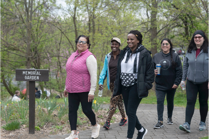 A group of people walking on a trail at Wildwood Park