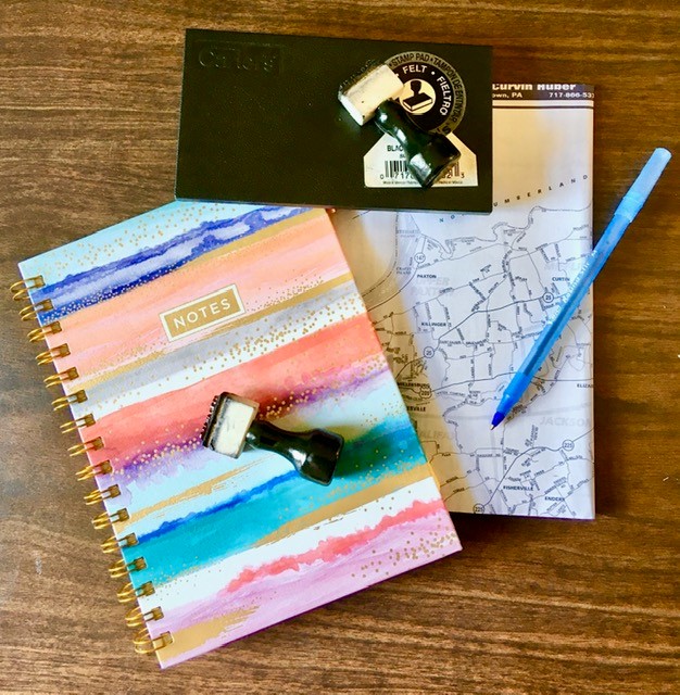 notebook, pen, stamp, on table