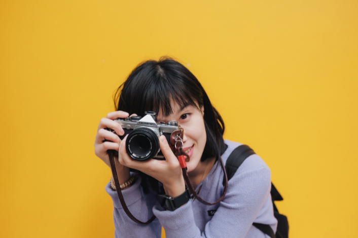Teenage girl with a camera