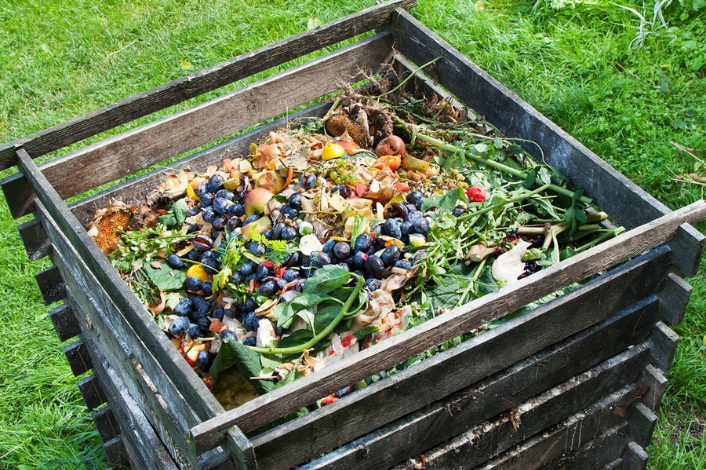 outdoor compost bin full of food scraps