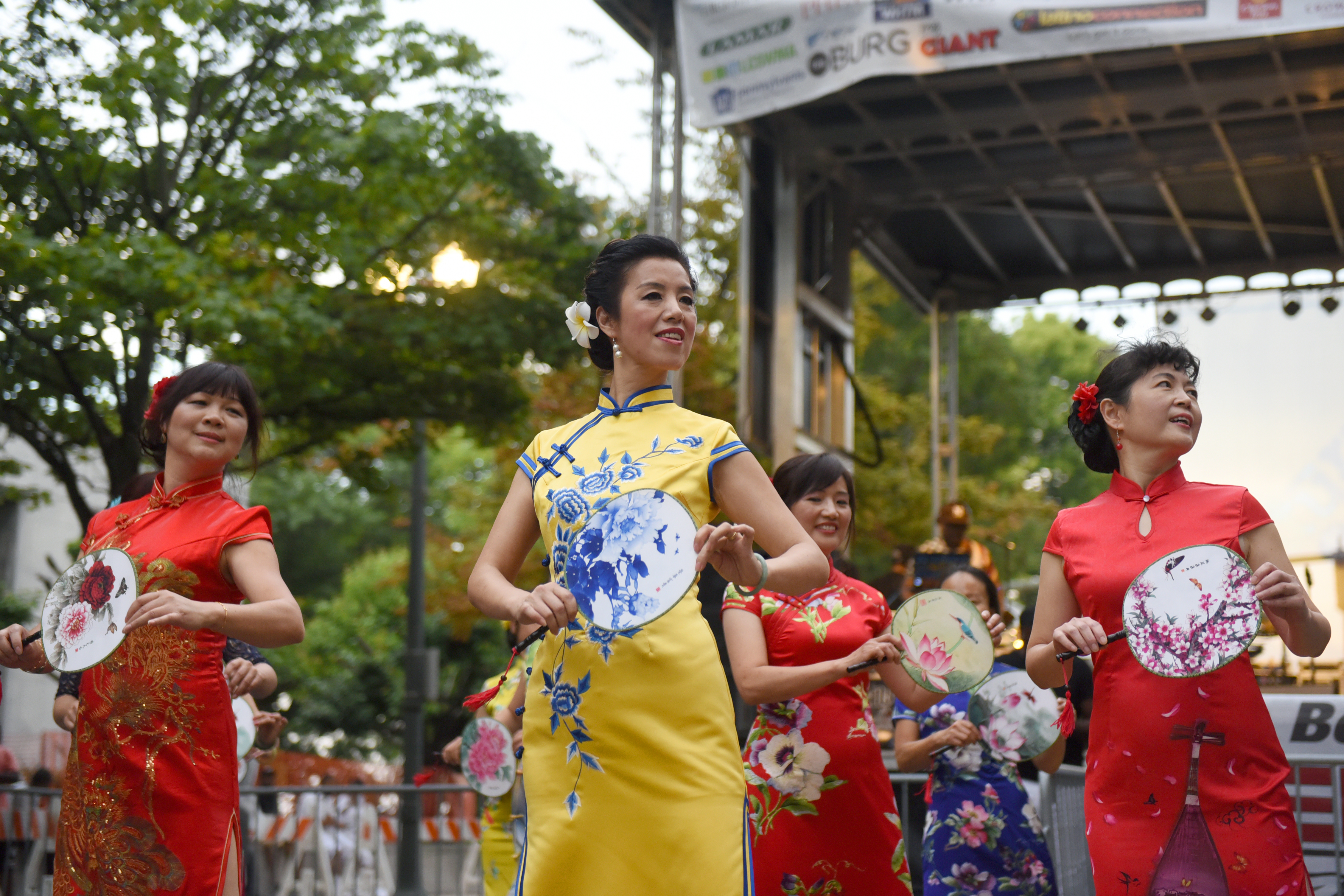 Dancers with colorful dresses and fans