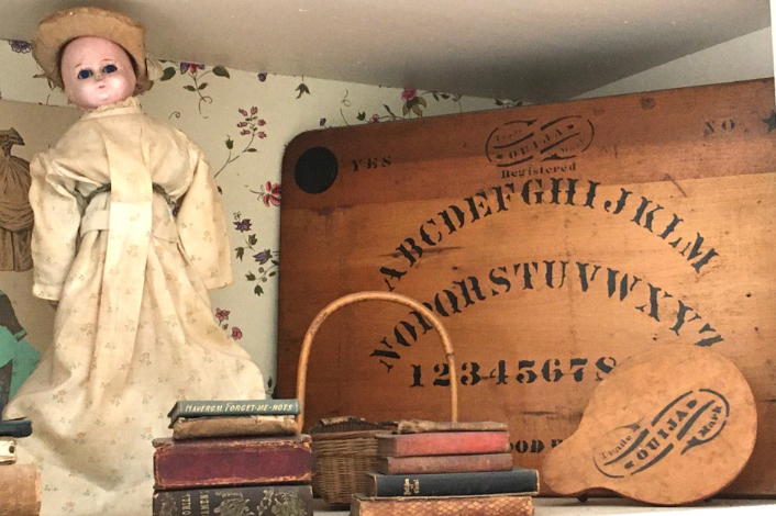 Antique doll, books, and game