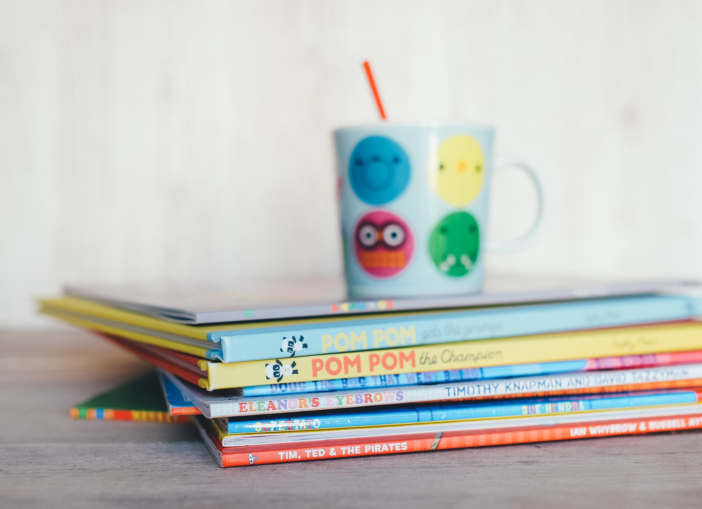 Books and a cup on a table