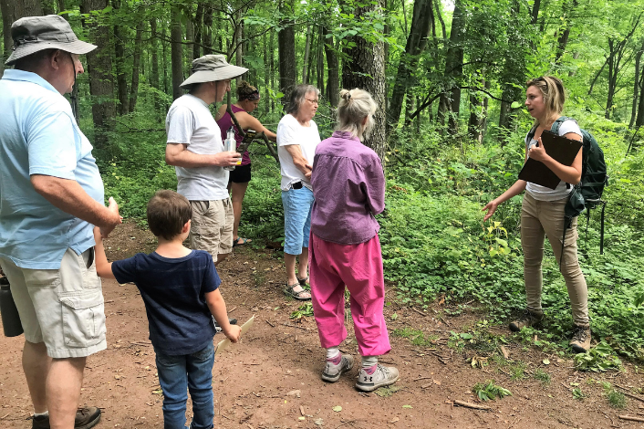 Group of walkers at Detweiler Park looking at plants