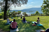 Outdoor yoga class with participants looking out over the Susquehanna River