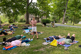 People laying on ground in meditation