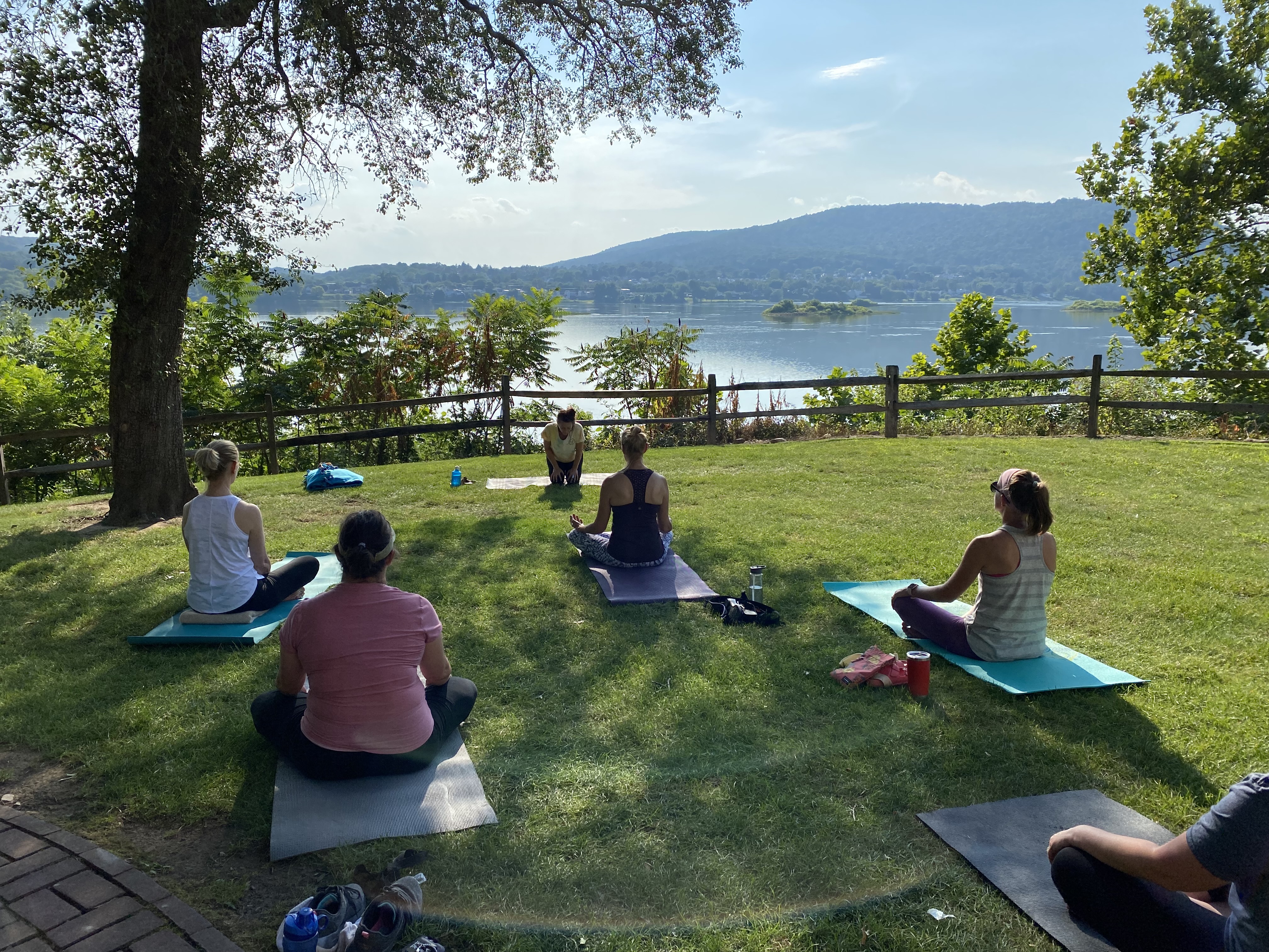 People on Yoga Mats on the Grass by the Susquehanna River