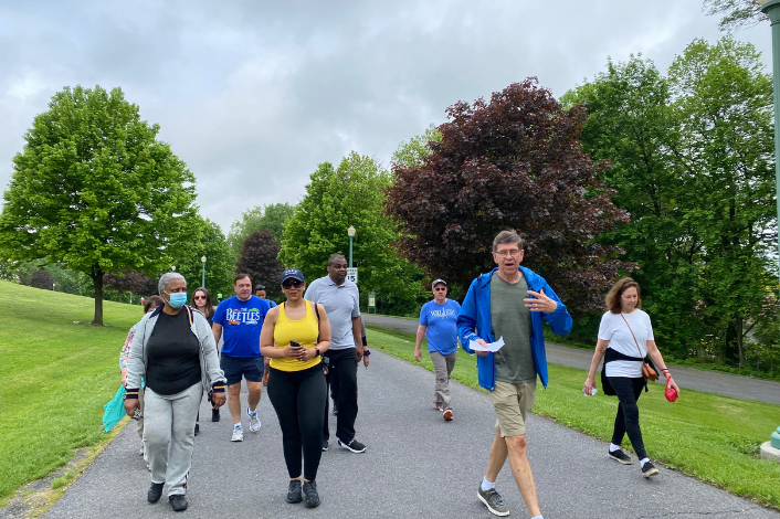 A group of people walking with a doctor