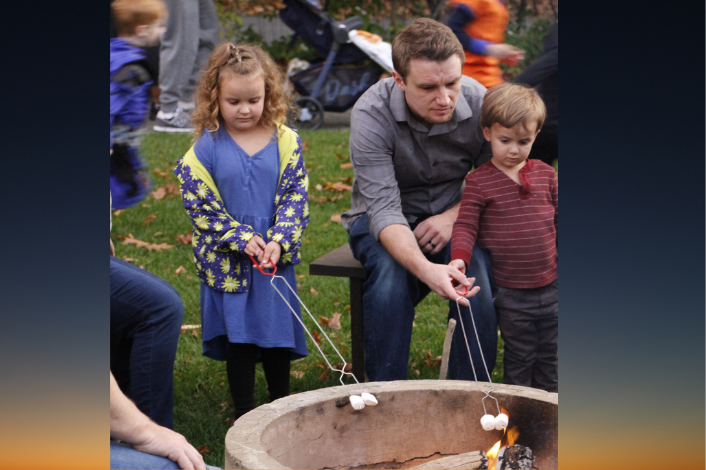 People roasting marshmallows