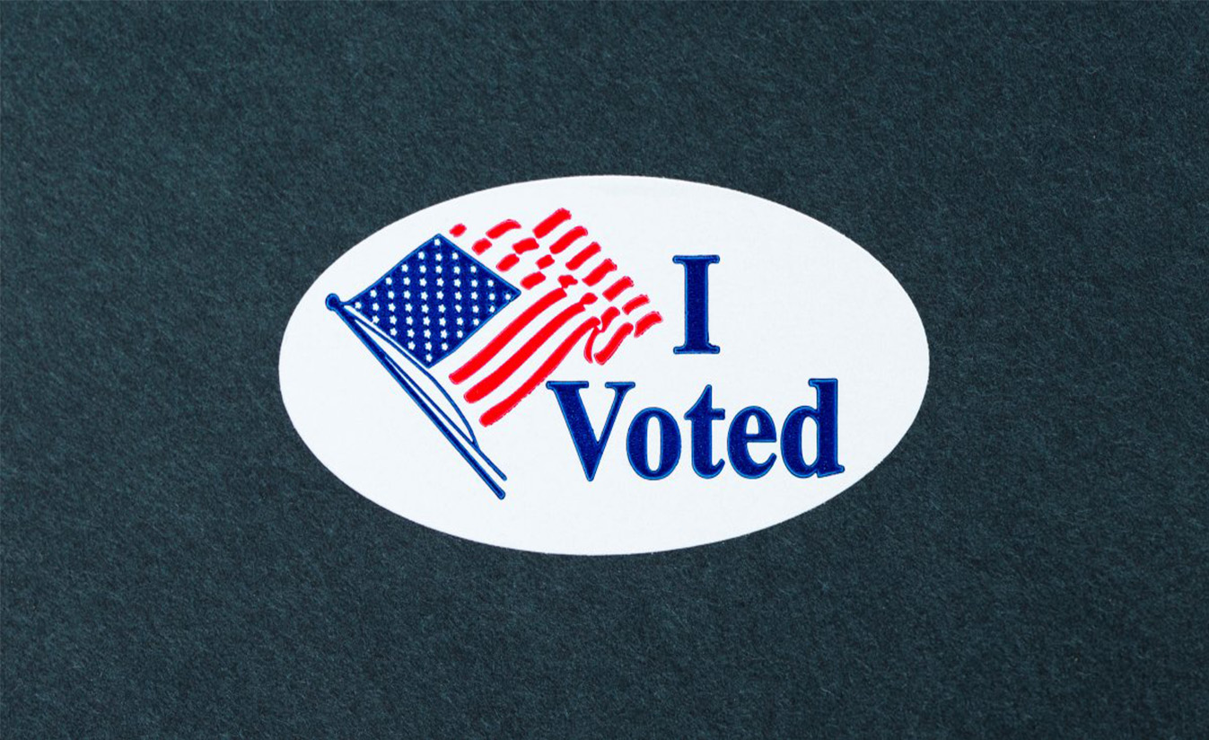 ElectionResultsBanner American flag with text I voted on a dark gray background